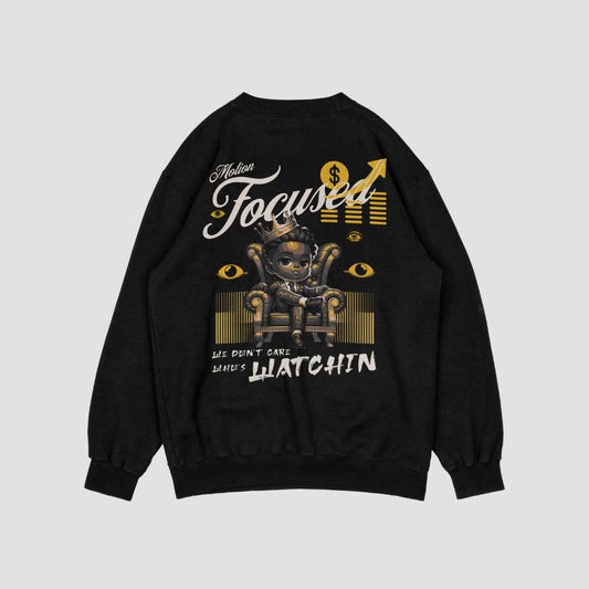 "Black sweatshirt featuring a bold design by Motion Focused, with a crowned character sitting on a throne, surrounded by gold accents, dollar signs, and watchful eyes. Includes the empowering slogan 'We Don't Care Who's Watchin' in stylish lettering."